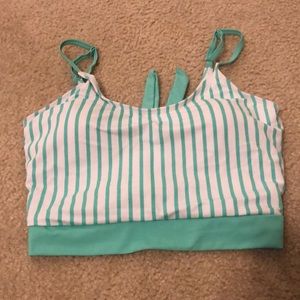 Never worn- coral reef swim top size s